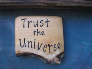 a plaque saying "trust the universe"